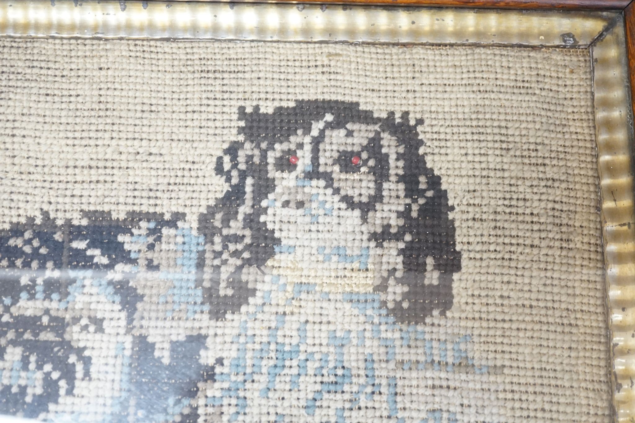 A framed Victorian needlework panel of a spaniel 30x37cm excl. frame